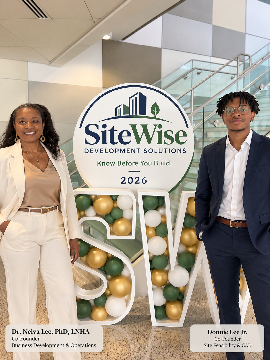 Dr. Nelva Lee and Donnie Lee Jr. beside SiteWise Development Solutions signage